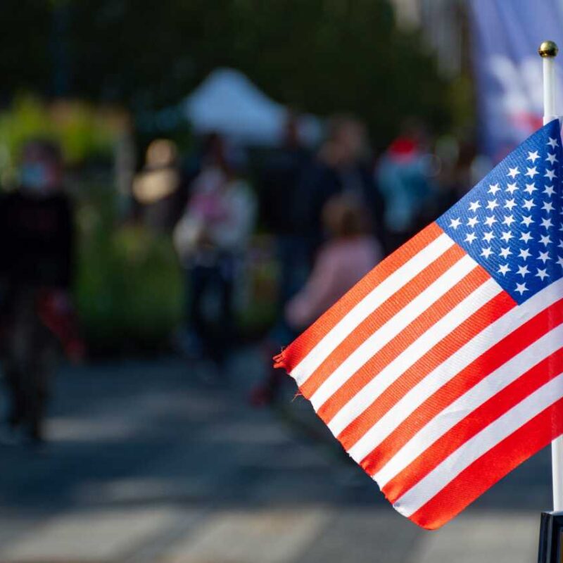 American flag waving on the car during United States Presidential election 2020 HFG Trust