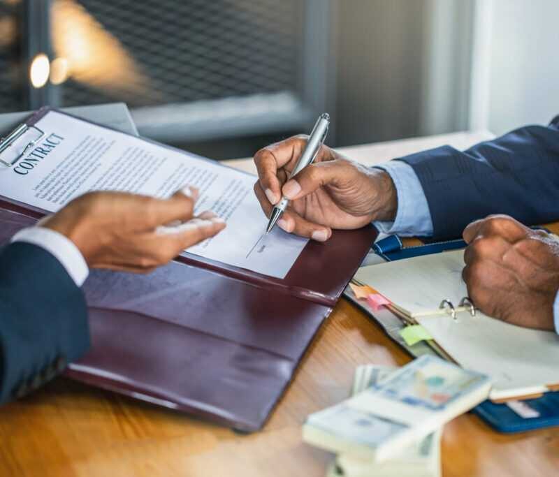 signing contract documents commercial loan HFG Trust