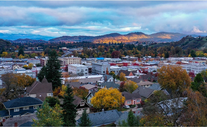 Downtown Roseburg, Oregon surrounded by fall colors, where HFG Trust fiduciary advisors provide financial planning for individuals, families, and business owners